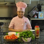 6-29-11%20Kid%20Chef%20Eliana%20prepares%20for%20her%20cooking%20class%20at%20Camp%20Girl%20Power.jpg