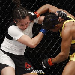 Viviane Pereira strikes Jamie Moyle at UFC 212.