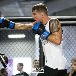 Darren Elkins hits mitts with coach Justin Buccholz at UFC on FOX 25 open workouts Thursday at UFC Gym in New Hyde Park, N.Y.