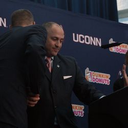 UConn Football Coach embraces UConn AD David Benedict.