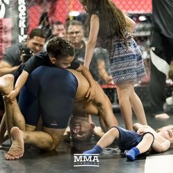 Chris Weidman is the victim of a dog pile at UFC on FOX 25 open workouts Thursday at UFC Gym in New Hyde Park, N.Y.