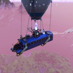 Players fly over the map in a “battle bus” powered by <em>Fortnite</em>’s fictional power source, called bluglo.