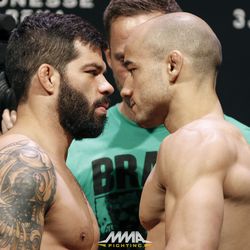 Raphael Assuncao squares off with Marlon Moraes at UFC 212 weigh-ins.