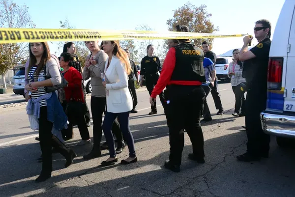 Survivors are evacuated from the scene of the shooting in San Bernadino.