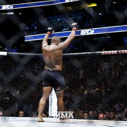Daniel Cormier celebrates after the round at UFC 214.