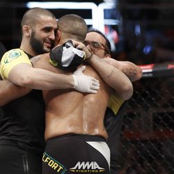Vitor Belfort gets a hug from his team after UFC 212.
