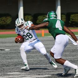 Dorian Brown trying to elude the Eastern Michigan defender.