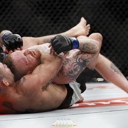 Luan Chagas sinks in the choke against Jim Wallhead at UFC 212.
