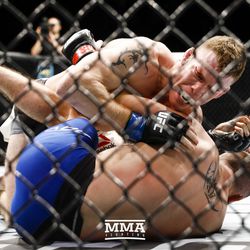 Paul Felder unloads with strikes on Stevie Ray at UFC Fight Night 113 on Sunday at the The SSE Hydro in Glasgow, Scotland.