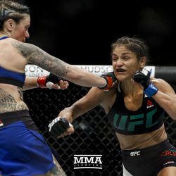 Joanne Calderwood and Cynthia Cavillo trade shots at UFC Fight Night 113 on Sunday at the The SSE Hydro in Glasgow, Scotland.