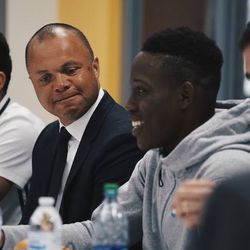 Jahmail Waite introduces himself to Don Garber during a lunch meeting as Earnie Stewart looks on