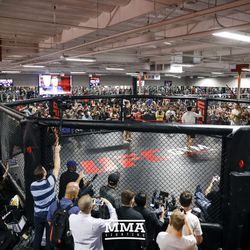 Cris Cyborg works out in front of a packed house.