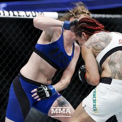 Tonya Evinger hits Cris Cyborg at UFC 214.