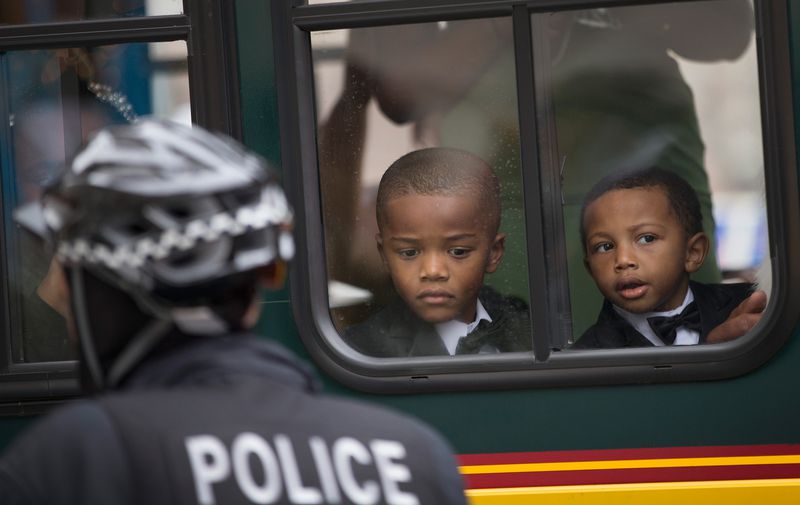 Young boys watch a protest in Chicago.