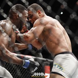 Paolo Borrachinha punches Oluwale Bamgbose at UFC 212.
