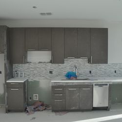 A kitchen being installed in a studio.