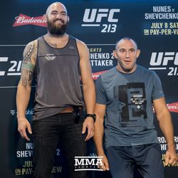 Travis Browne and Oleksiy Oliynyk pose at UFC 213 media day.