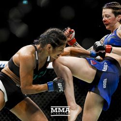 Joanne Calderwood knees Cynthia Cavillo at UFC Fight Night 113 on Sunday at the The SSE Hydro in Glasgow, Scotland.
