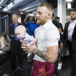 Conor McGregor poses with son at media workout.