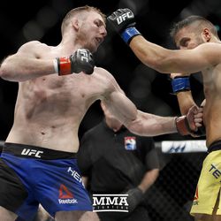Danny Henry goes to the body on Daniel Teymur at UFC Fight Night 113 on Sunday at the The SSE Hydro in Glasgow, Scotland.