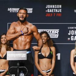 Dhiego Lima hits the scale at the TUF 25 Finale ceremonial weigh-ins Thursday at Park Theater in Las Vegas.
