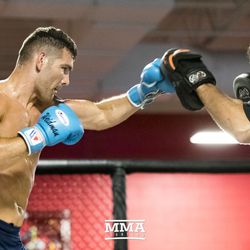 Chris Weidman hitting mitts at UFC on FOX 25 open workouts Thursday at UFC Gym in New Hyde Park, N.Y.
