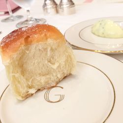 A Parker House roll and incredibly glossy butter