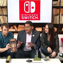 Nintendo’s Nate Bihldorff holds up the Sheikah Slate carrying case for the Switch hardware.