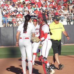 Danielle O’Toole and Dejah Mulipola meet in the pitcher’s circle