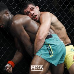 Renan Barao tries to take down Aljamain Sterling at UFC 214.