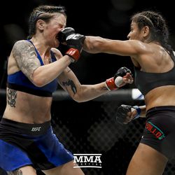 Joanne Calderwood eats a hard left from Cynthia Cavillo at UFC Fight Night 113 on Sunday at the The SSE Hydro in Glasgow, Scotland.