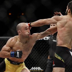 Marlon Moraes punches Raphael Assuncao at UFC 212.