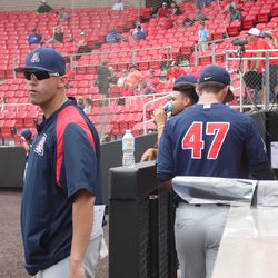 Cameron Ming enters the dugout after pregame warmups