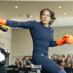 Amanda Nunes throws a spinning backfist at UFC 215 open workouts at the Rogers Place in Edmonton, Alberta, Canada.