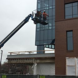 Work on windows on the north side of the plaza building