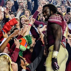 Jr. RB Dalvin Cook celebrates after the game with the student section.