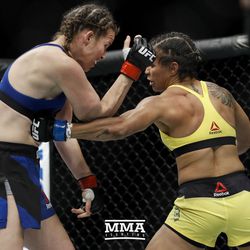 Amanda Lemos lands a left to the body on Leslie Smith at UFC Fight Night 113 on Sunday at the The SSE Hydro in Glasgow, Scotland.