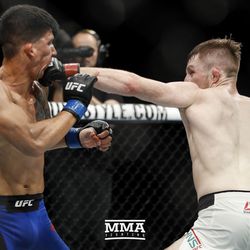 Brett Johns lands a right on Albert Morales at UFC Fight Night 113 on Sunday at the The SSE Hydro in Glasgow, Scotland.