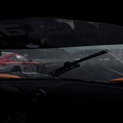 A McLaren 650S GT3 and a Mercedes-Benz AMG GT3 in the rain at Fuji Speedway.