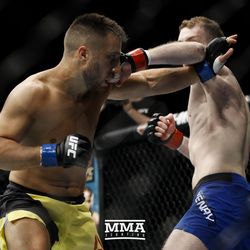Daniel Teymur trades punches with Danny Henry at UFC Fight Night 113 on Sunday at the The SSE Hydro in Glasgow, Scotland.
