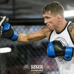 Darren Elkins hitting mitts at UFC on FOX 25 open workouts Thursday at UFC Gym in New Hyde Park, N.Y.