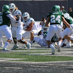 A.J. Oullette looking for a hole in the Eastern Michigan defense.<br>