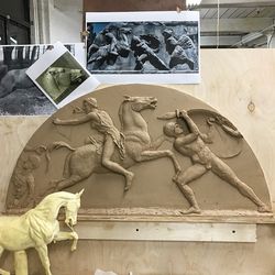 A clay prototype for a relief that will be installed above a doorway. 