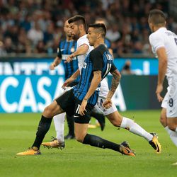 Matias Vecino of FC Internazionale Milano (front) competes for the ball with Marco Benassi of ACF Fiorentina during the Serie A match between FC Internazionale and ACF Fiorentina at Stadio Giuseppe Meazza on August 20, 2017 in Milan, Italy.