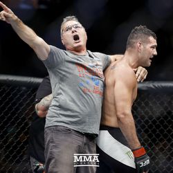 Chris Weidman’s father celebrates with his son after the fight at UFC on FOX 25.