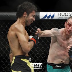 Neil Seery throws a right hand at Alexandre Pantoja at UFC Fight Night 113 on Sunday at the The SSE Hydro in Glasgow, Scotland.