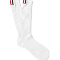 This might seem ridiculous, but if your groomsmen are a fashionable bunch, give them these ultra-stylish socks: Thom Browne <a href="https://www.mrporter.com/en-us/mens/thom_browne/ribbed-mid-calf-sock-in-lightweight-cotton/818187?&ignoreRedirect=true&ppv=2&cm_mmc=Google-ProductSearch-US--c-_-MRP_EN_US_PLA-_-MRP_US_GS_Designers+%28Low%29--Designers_AM&gclid=CN6Mw7CLjtQCFUO5wAodq28K0w#">Ribbed Mid-Calf Sock In Lightweight Cotton</a> ($90)