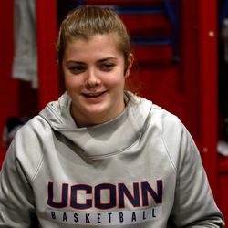 UConn’s Kyla Irwin plays cards before practice.<br>