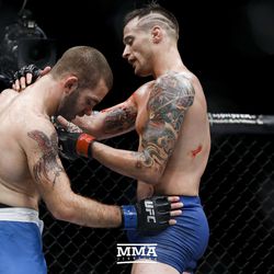 James Krause checks on his opponent after their TUF 25 Finale opponent.