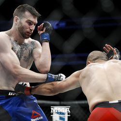 Chad Laprise hits Brian Camozzi with a body shot at UFC 213.